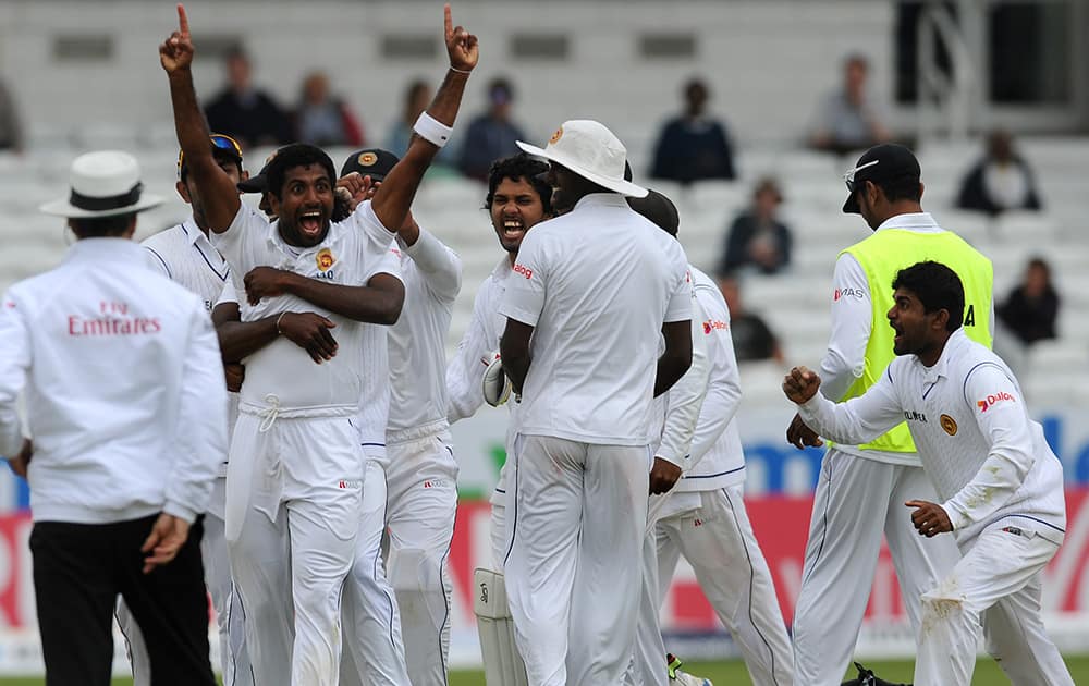 Sri Lanka's Dhammika Prasad celebrates after a review confirms he bowled England's Matt Prior, caught by Kaushal Silva for 10 runs, during day five of the Second Test Match between England and Sri Lanka at Headingley cricket ground, Leeds, England.