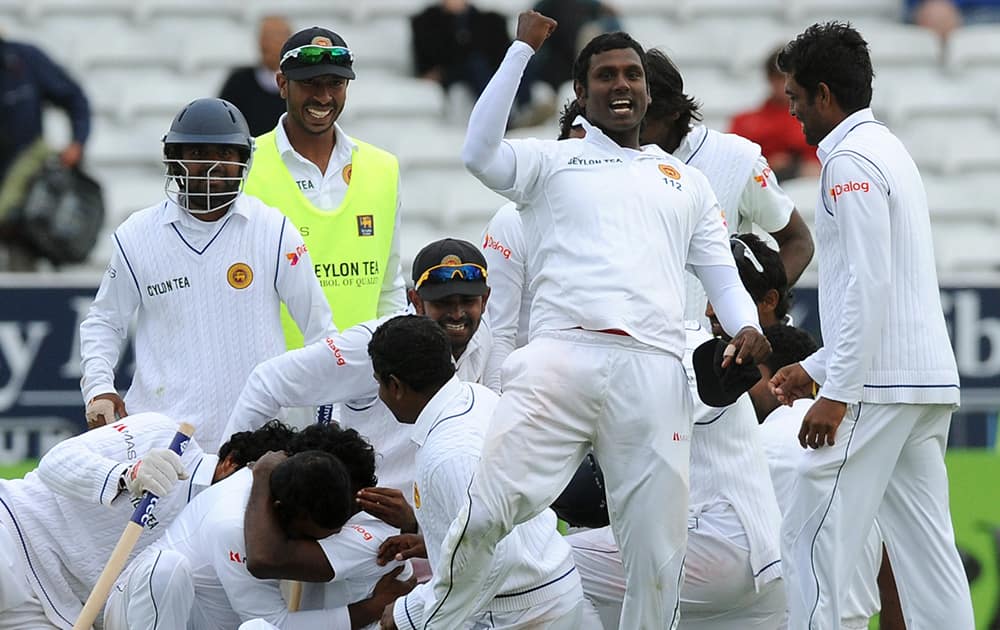 Sri Lanka's captain Angelo Mathews leads celebrations as Sri Lanka beat England by 100 runs to win the series, during day five of the Second Test Match between England and Sri Lanka at Headingley cricket ground, Leeds, England.