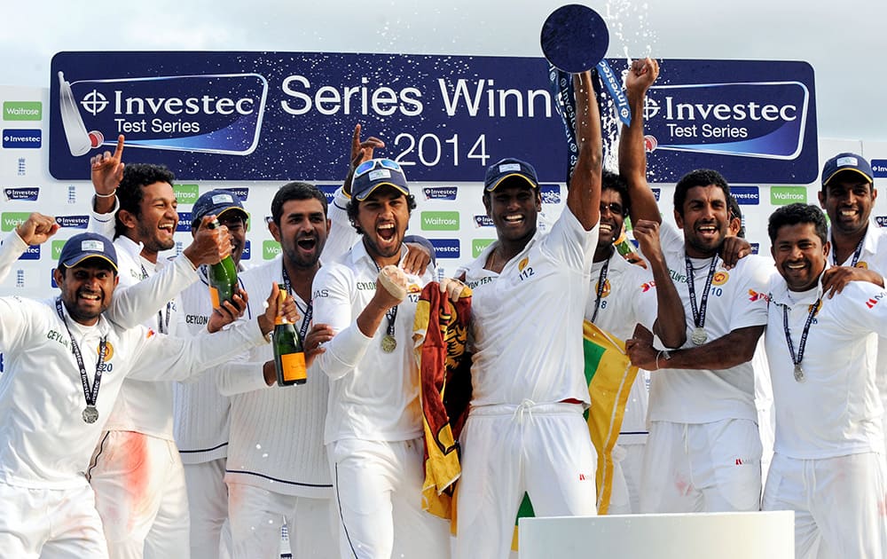 Sri Lanka players celebrate with the trophy after beating England by 100 runs to win the series during day five of the Second Test Match between England and Sri Lanka at Headingley cricket ground, Leeds, England.