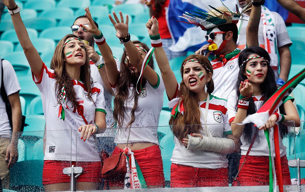 Iran's fans cheer for their team during the group F World Cup soccer match between Bosnia and Iran at the Arena Fonte Nova in Salvador, Brazil.