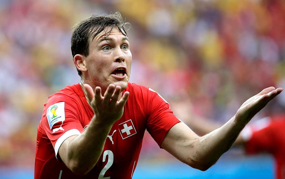 Switzerland's Stephan Lichtsteiner reacts during the group E World Cup soccer match between Honduras and Switzerland at the Arena da Amazonia in Manaus, Brazil.