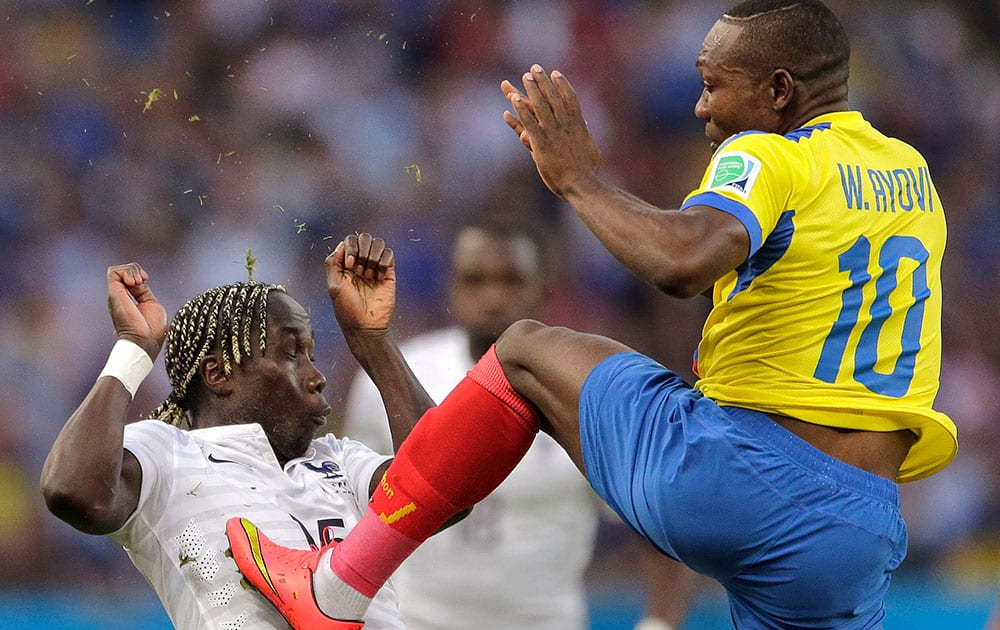 France's Bacary Sagna ends up with Ecuador's Walter Ayovi's cleats in his chest after he kicked the ball away during the group E World Cup soccer match between Ecuador and France at the Maracana Stadium in Rio de Janeiro, Brazil.