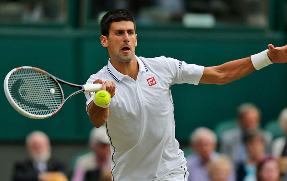 Novak Djokovic of Serbia returns to Radek Stepanek of Czech Republic during their men's singles match at the All England Lawn Tennis Championships in Wimbledon.