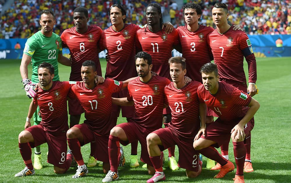 The Portugal team pose for a group photo before the group G World Cup soccer match between Portugal and Ghana at the Estadio Nacional in Brasilia, Brazil,.