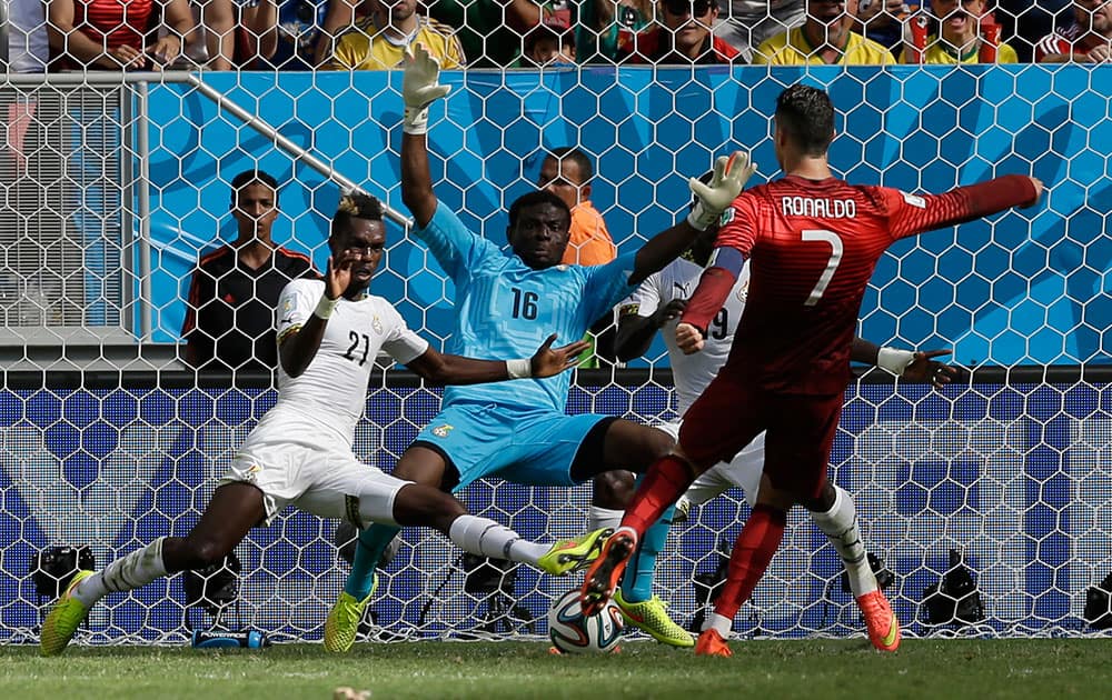 Portugal's Cristiano Ronaldo scores his side's second goal during the group G World Cup soccer match between Portugal and Ghana at the Estadio Nacional in Brasilia, Brazil.