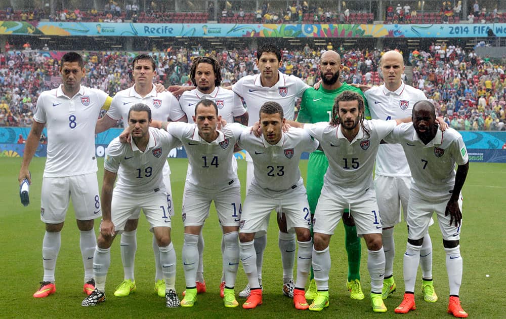 The USA national team pose before the group G World Cup soccer match between the United States and Germany at the Arena Pernambuco in Recife, Brazil