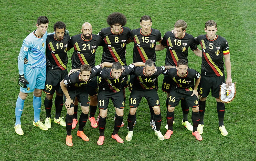 The team from Belgium pose for a team photo before the group H World Cup soccer match between South Korea and Belgium at the Itaquerao Stadium in Sao Paulo, Brazil.