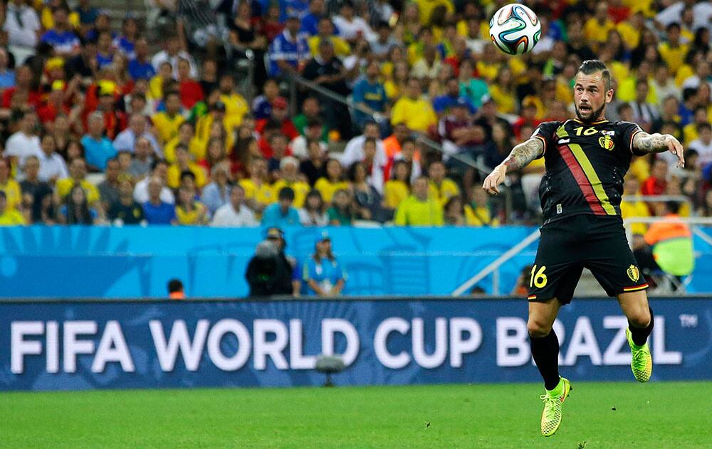 Belgium's Steven Defour heads the ball during the group H World Cup soccer match between South Korea and Belgium at the Itaquerao Stadium in Sao Paulo, Brazil.