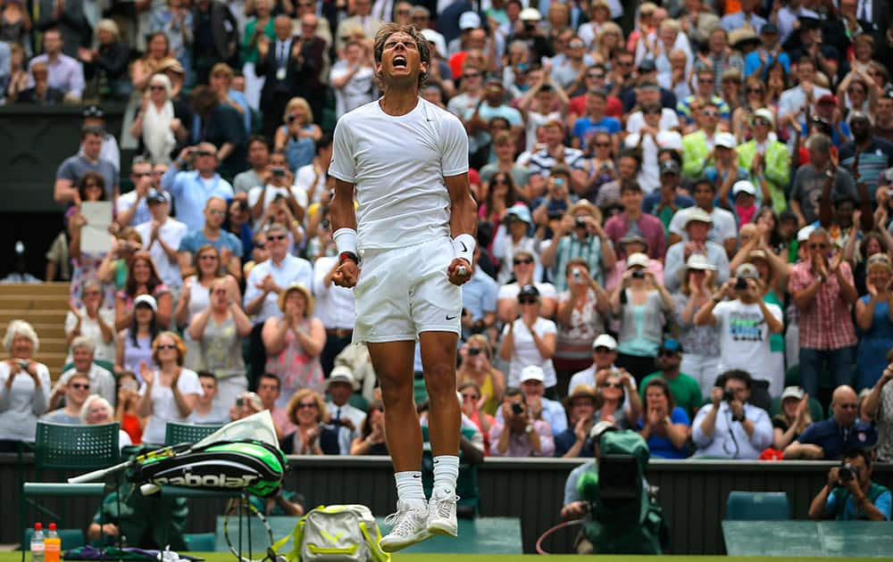 Rafael Nadal of Spain celebrates after he defeated Lukas Rosol of the Czech Republic in their men's singles match on Centre Court at the All England Lawn Tennis Championships in Wimbledon, London.