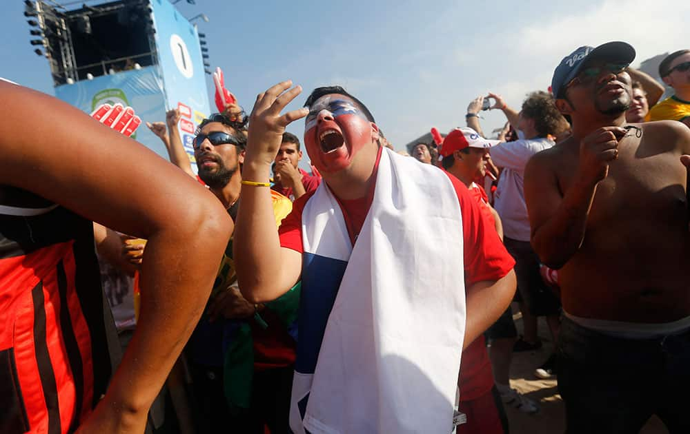 A Chile soccer fan complains as he watches a live telecast of his team's World Cup round of 16 match with Brazil at the FIFA Fan Fest area on Copacabana beach in Rio de Janeiro, Brazil.