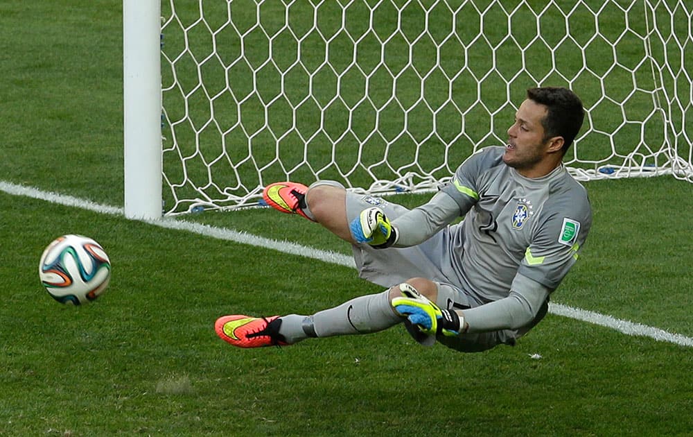 Brazil's goalkeeper Julio Cesar make a save in the shoot-out of the World Cup round of 16 soccer match between Brazil and Chile at the Mineirao Stadium in Belo Horizonte, Brazil.