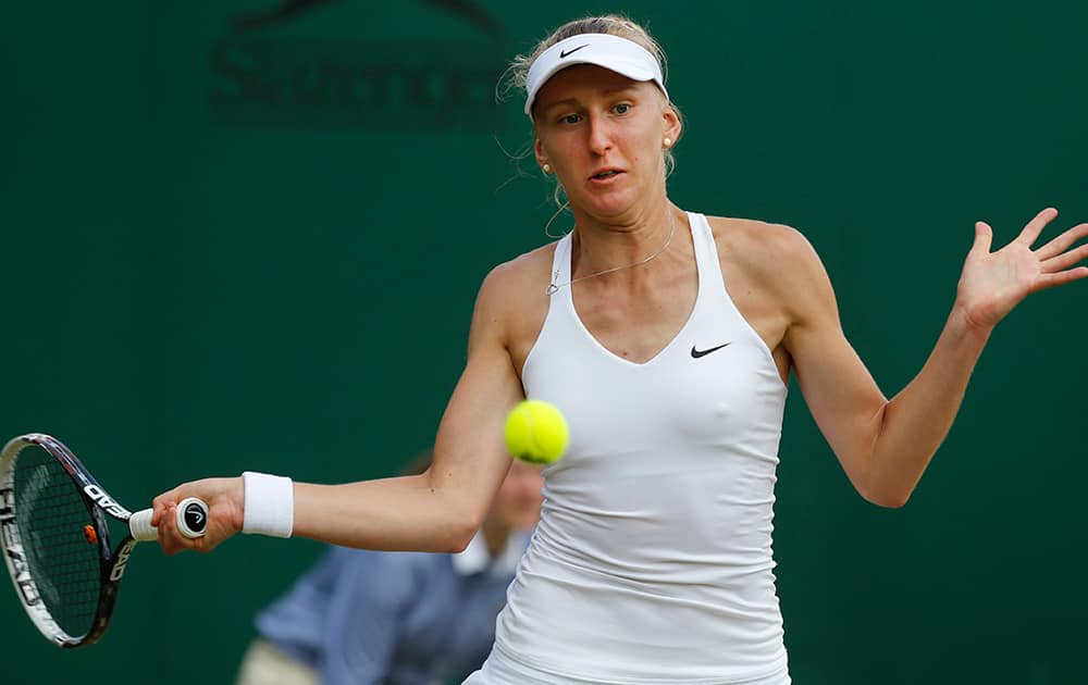 Tereza Smitkova of the Czech Republic plays a return to Lucie Safarova of the Czech Republic during their women's singles match at the All England Lawn Tennis Championships in Wimbledon.