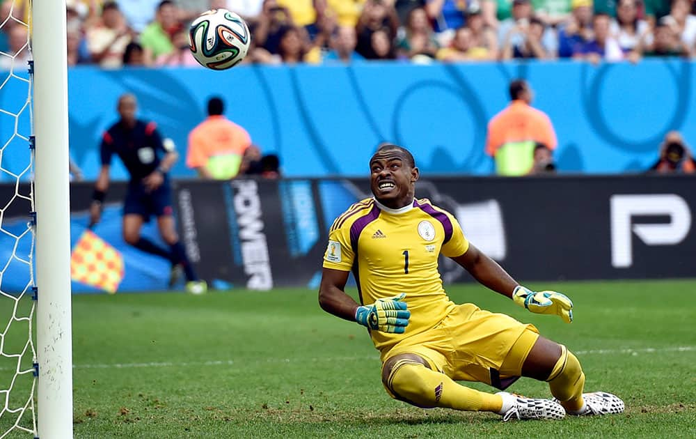 Nigeria's goalkeeper Vincent Enyeama looks as a shot goes wide during the World Cup round of 16 soccer match between France and Nigeria at the Estadio Nacional in Brasilia, Brazil.