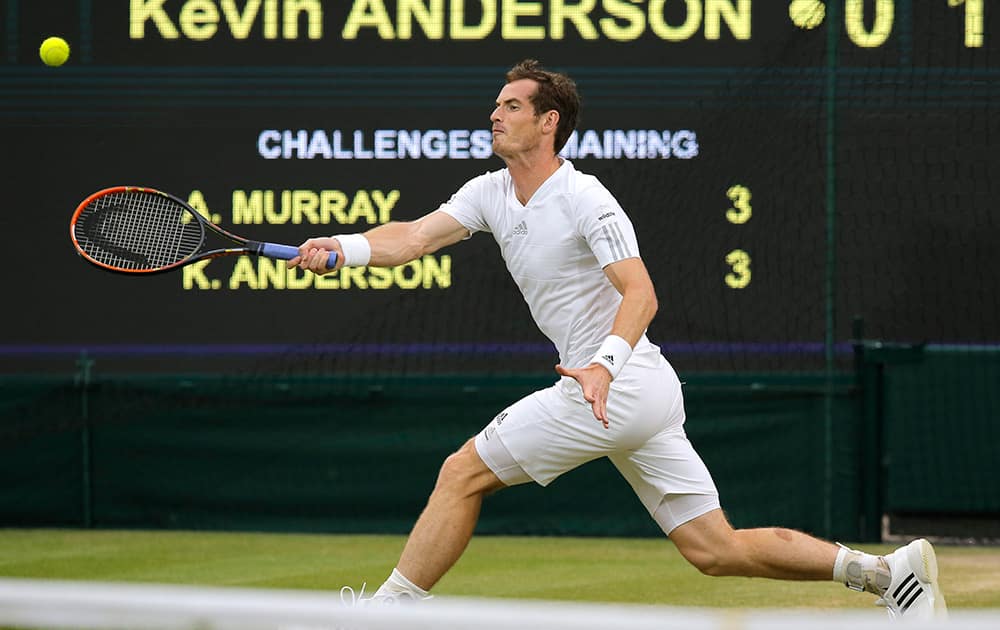 Andy Murray of Britain stretches to reach a ball played by Kevin Anderson of South Africa during their match at the All England Lawn Tennis Championships in Wimbledon