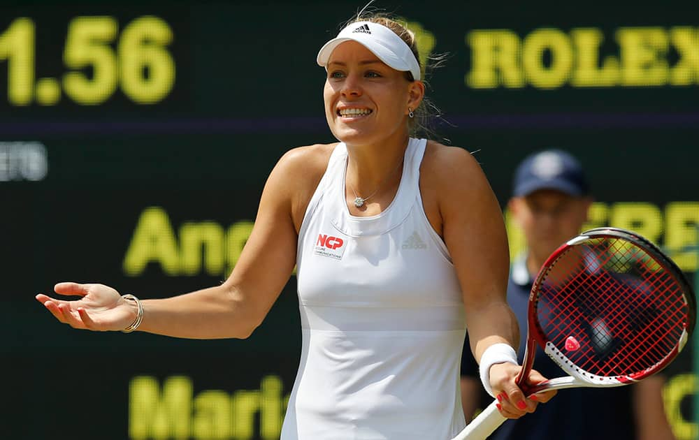 Angelique Kerber of Germany gestures during her women's singles match against Maria Sharapova of Russia at the All England Lawn Tennis Championships in Wimbledon, London.