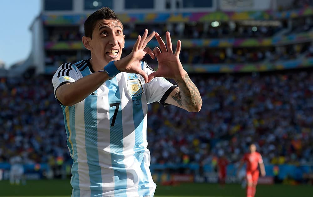 Argentina's Angel di Maria celebrates after scoring his side's only and winning goal in extra time during the World Cup round of 16 soccer match between Argentina and Switzerland at the Itaquerao Stadium in Sao Paulo, Brazil.