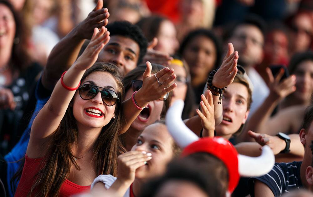 Swiss supporters react as they watch the FIFA World Cup round of 16 soccer match between Argentina and Switzerland taking place in Brazil, in a fan zone in Lausanne, Switzerland.