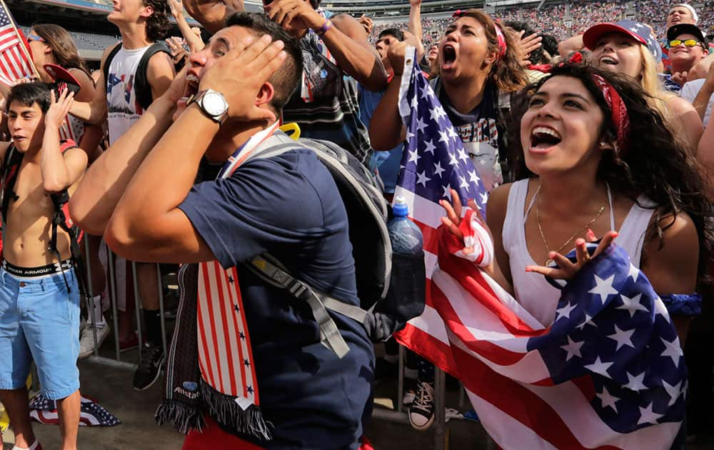 Fans cheer for the U.S. during the Brazil 2014 World Cup viewing party at Soldier Field  in Chicago. 