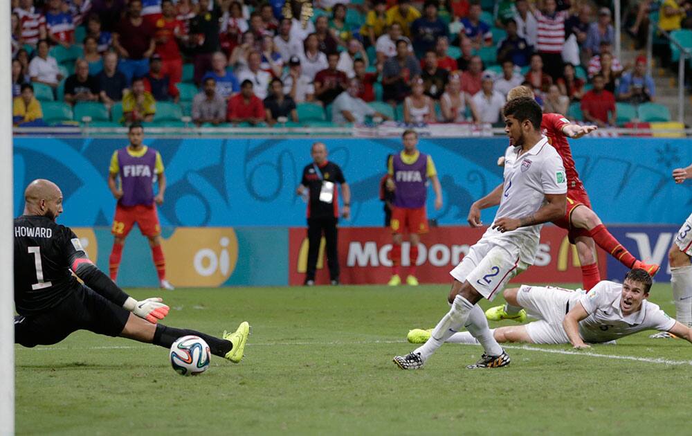 United States' goalkeeper Tim Howard, left, is beaten by a shot from Belgium's Kevin De Bruyne for the opening goal during the World Cup round of 16 soccer match between Belgium and the USA at the Arena Fonte Nova in Salvador, Brazil.