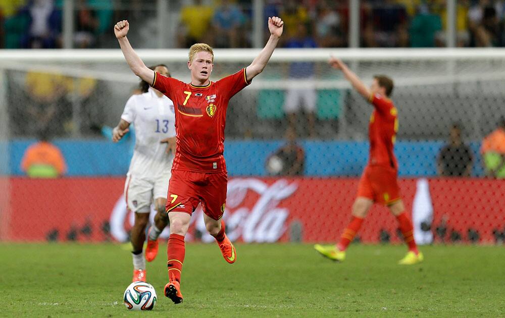 Belgium's Kevin De Bruyne celebrates as the match ends and Belgium defeated the USA 2-1 in extra time to advance to the quarterfinals during the World Cup round of 16 soccer match between Belgium and the USA at the Arena Fonte Nova in Salvador, Brazil.