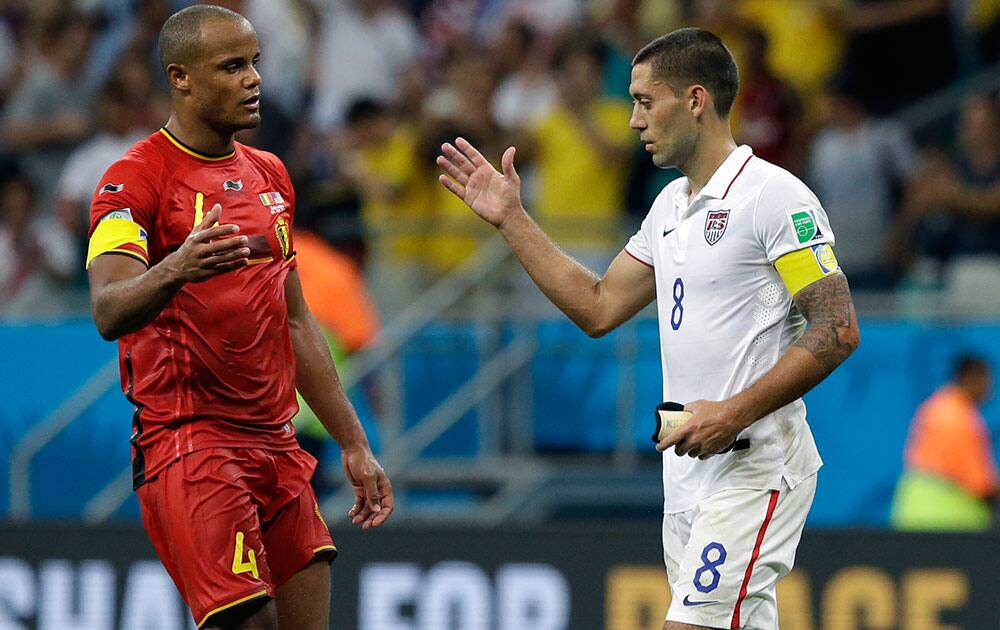 Belgium's Vincent Kompany, left, greets United States' Clint Dempsey after the World Cup round of 16 soccer match between Belgium and the USA at the Arena Fonte Nova in Salvador, Brazil.