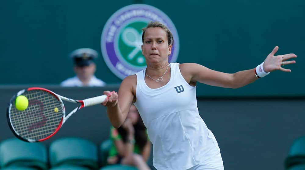 Barbora Zahlavova Strycova of the Czech Republic plays a return to Petra Kvitova of the Czech Republic during their match at the All England Lawn Tennis Championships in Wimbledon.