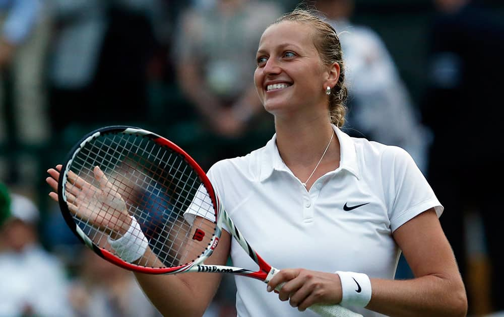 Petra Kvitova of Czech Republic celebrates defeating Barbora Zahlavova Strycova of Czech Republic in their women's singles match at the All England Lawn Tennis Championships in Wimbledon.