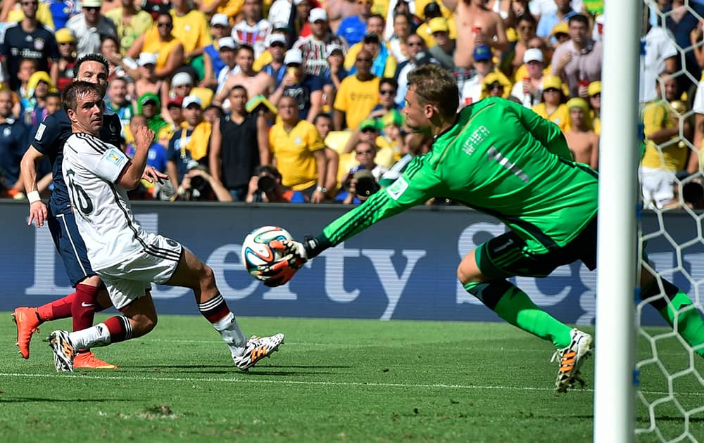 Germany's goalkeeper Manuel Neuer makes a save during the World Cup quarterfinal soccer match between Germany and France at the Maracana Stadium in Rio de Janeiro, Brazil.