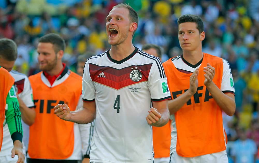 Germany's Benedikt Hoewedes celebrates after the World Cup quarterfinal soccer match between Germany and France at the Maracana Stadium in Rio de Janeiro, Brazil.