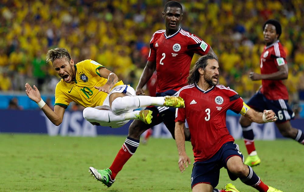 Brazil's Neymar is airborne after running in to Colombia's Mario Yepes during the World Cup quarterfinal soccer match between Brazil and Colombia at the Arena Castelao in Fortaleza, Brazil.