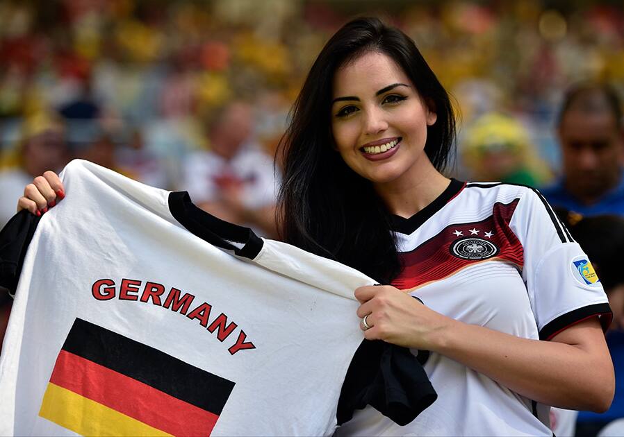 A Germany supporter smiles before the World Cup quarterfinal soccer match between Germany and France at the Maracana Stadium in Rio de Janeiro, Brazil.