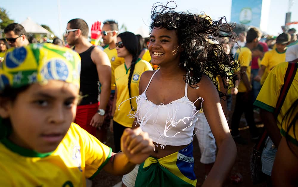 Brazil soccer fans gather inside the FIFA Fan Fest area during the World Cup game between Colombia and Brazil in Taquatinga, Brazil.