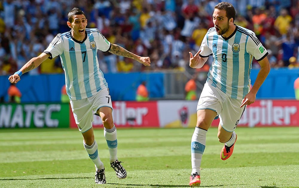 Argentina's Gonzalo Higuain, right, celebrates with Angel di Maria after scoring the opening goal during the World Cup quarterfinal soccer match between Argentina and Belgium at the Estadio Nacional in Brasilia, Brazil.