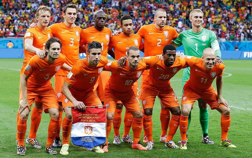 The Netherlands' team poses before the World Cup quarterfinal soccer match between the Netherlands and Costa Rica at the Arena Fonte Nova in Salvador, Brazil.