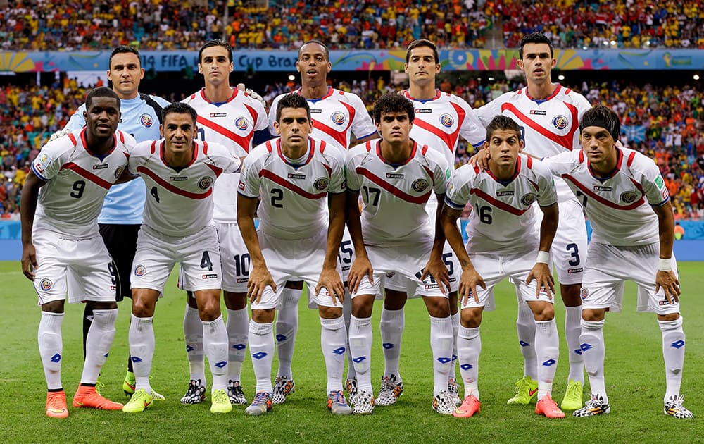 The Costa Rica team poses for a group photo before the World Cup quarterfinal soccer match between the Netherlands and Costa Rica at the Arena Fonte Nova in Salvador, Brazil.