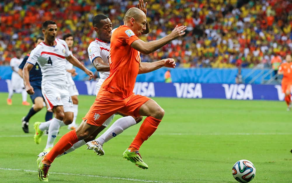 Netherlands' Arjen Robben runs with the ball during the World Cup quarterfinal soccer match between the Netherlands and Costa Rica at the Arena Fonte Nova in Salvador, Brazil.