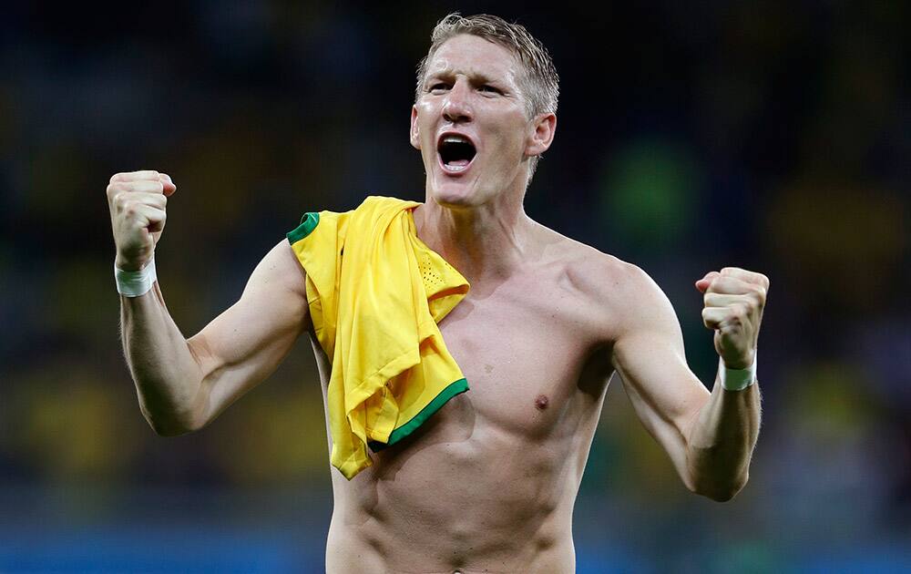 Germany's Bastian Schweinsteiger celebrates after the World Cup semifinal soccer match between Brazil and Germany at the Mineirao Stadium in Belo Horizonte, Brazil.