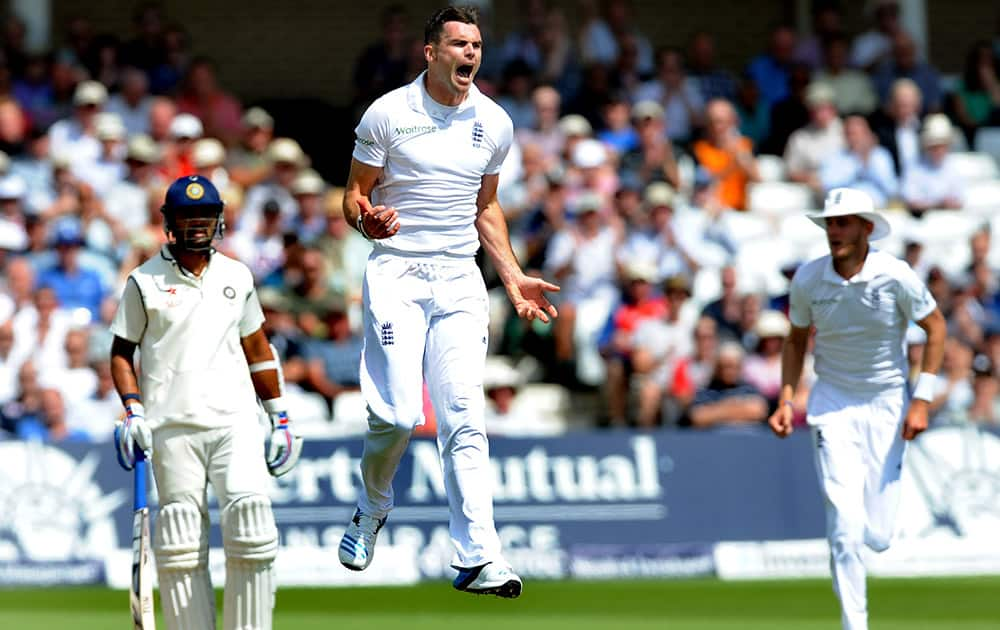 England's James Anderson celebrates after bowling India's Shikhar Dhawan caught by Matt Prior for 12 runs during day one of the first Test between England and India at Trent Bridge cricket ground, Nottingham.