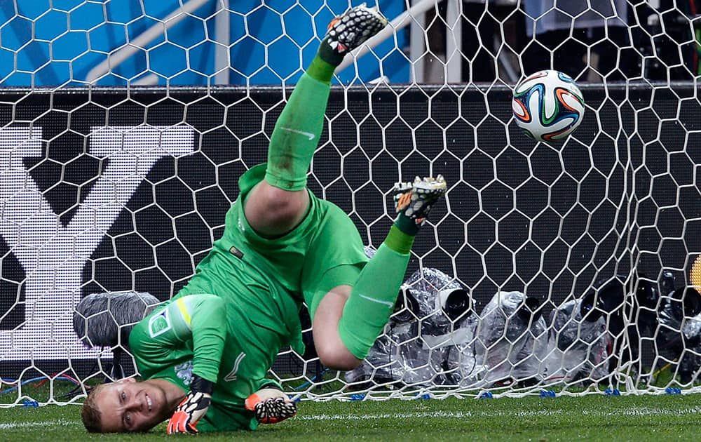 Netherlands' goalkeeper Jasper Cillessen fails to make a save in a shootout at the end of the World Cup semifinal soccer match between the Netherlands and Argentina at the Itaquerao Stadium in Sao Paulo Brazil.