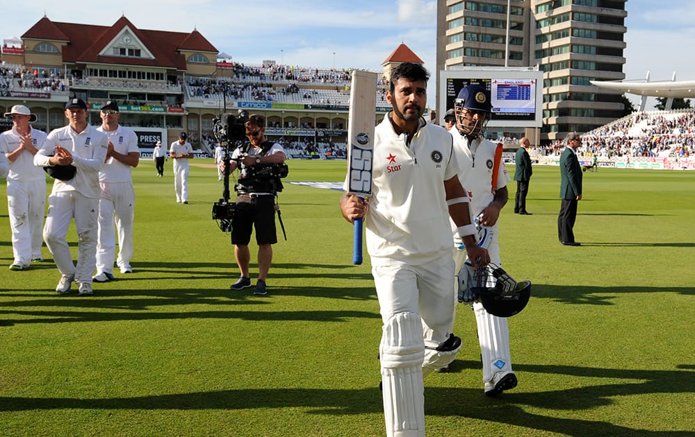 India's Murali Vijay leaves the field after scoring 122 runs not out, at the end of play of day one of the first Test between England and India at Trent Bridge cricket ground, Nottingham, England