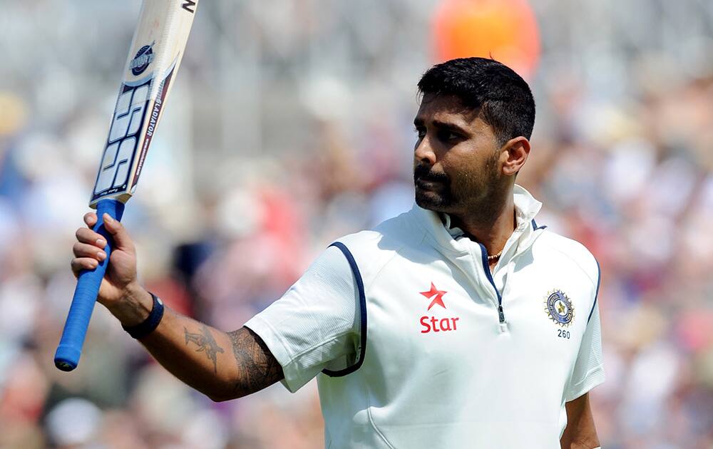 Murali Vijay acknowledges fans as he walks back to the pavilion after being given out lbw for 146 runs by England's James Anderson during day two of the first Test between England and India at Trent Bridge cricket ground, Nottingham, England.