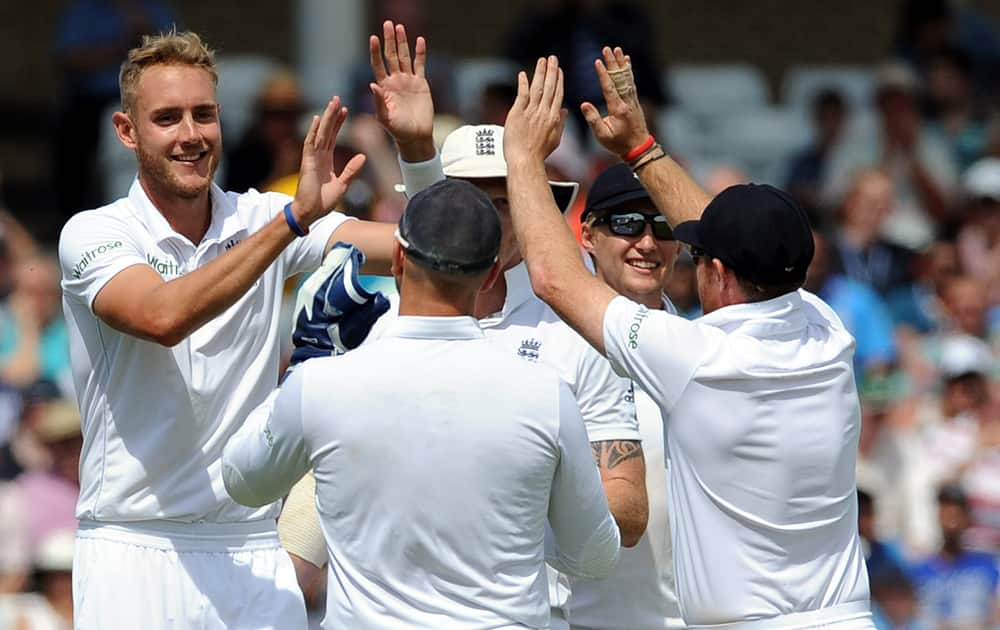 England's Stuart Broad is congratulated by teammates after bowling India's Ishant Sharma for one run during day two of the first Test between England and India at Trent Bridge cricket ground, Nottingham, England.