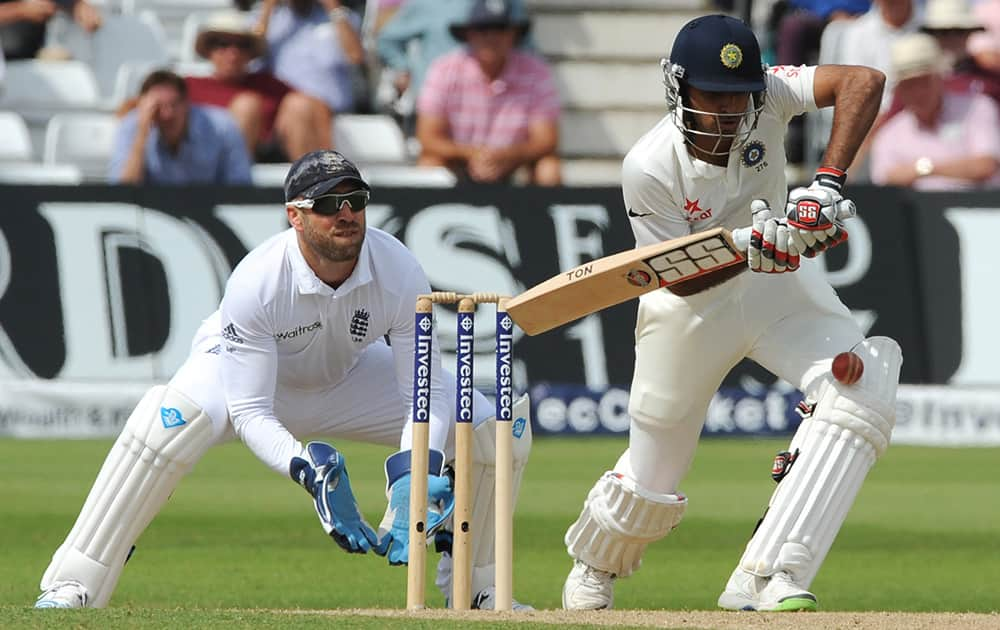 India's Bhuvneshwar Kumar plays a shot watched by England's wicketkeeper Matt Prior during day two of the first Test between England and India at Trent Bridge cricket ground, Nottingham, England.