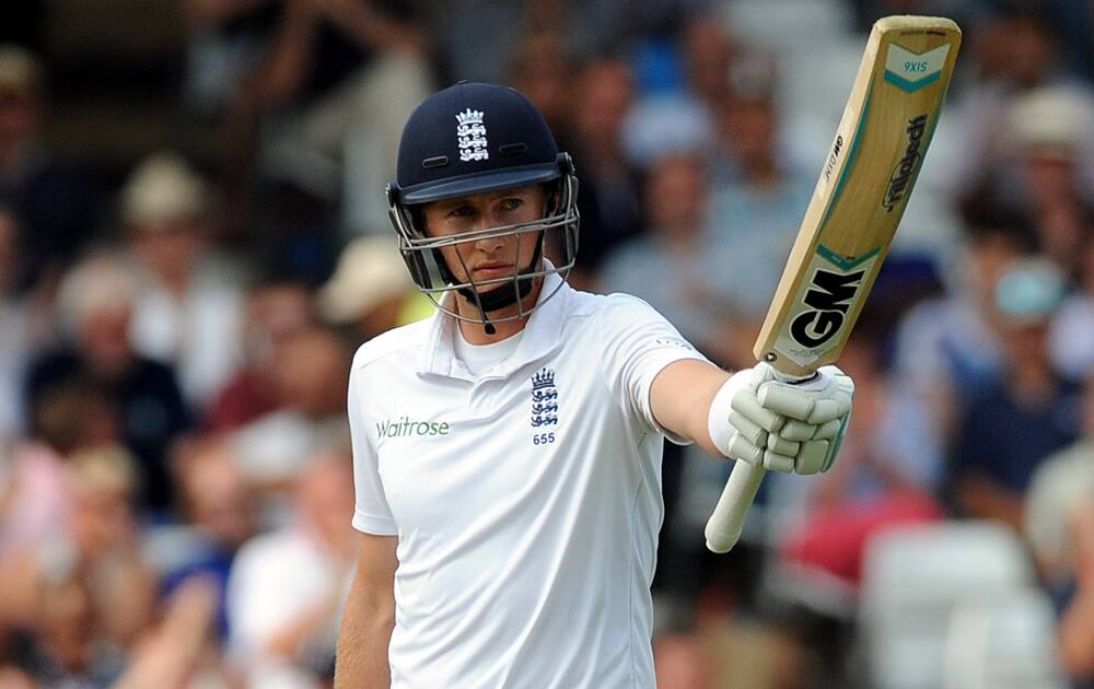 England's Joe Root celebrates after scoring a half century during day three of the first Test between England and India at Trent Bridge cricket ground, Nottingham.