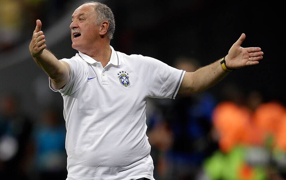 Brazil's coach Luiz Felipe Scolari yells instructions to his players during the World Cup third-place soccer match between Brazil and the Netherlands at the Estadio Nacional in Brasilia, Brazil.