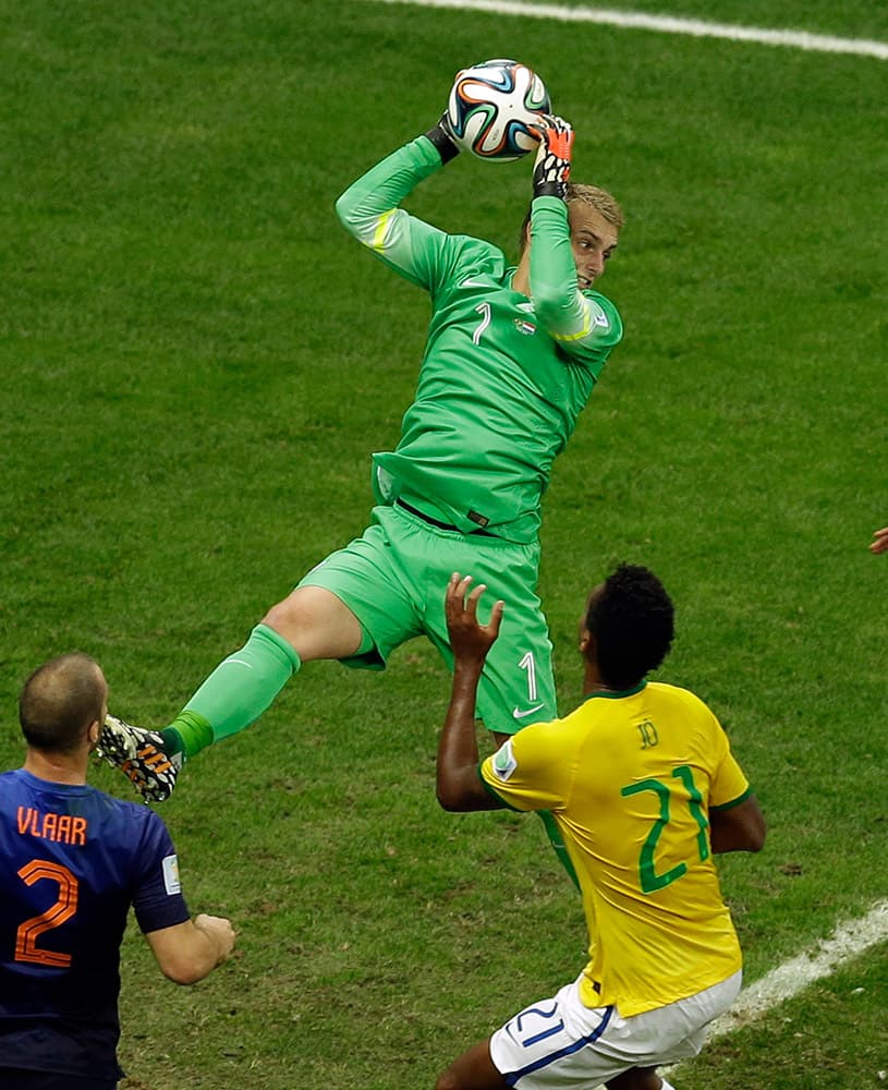 Netherlands' goalkeeper Jasper Cillessen grabs the ball during the World Cup third-place soccer match between Brazil and the Netherlands at the Estadio Nacional in Brasilia, Brazil.