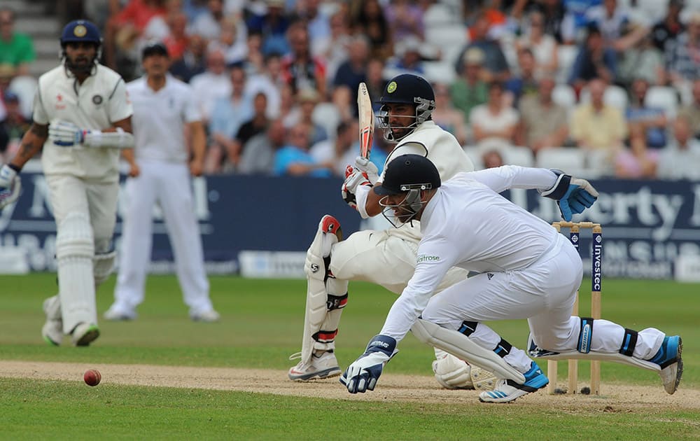 India's Cheteshwar Pujara plays a shot past England's wicket keeper Matt Prior during day four of the first Test between England and India at Trent Bridge cricket ground, Nottingham, England.