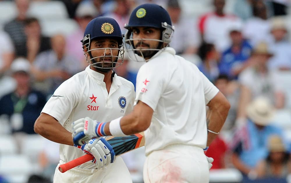 India's Ajinkya Rahane, left, and Virat Kohli run between the wickets during day four of the first Test between England and India at Trent Bridge cricket ground, Nottingham, England.