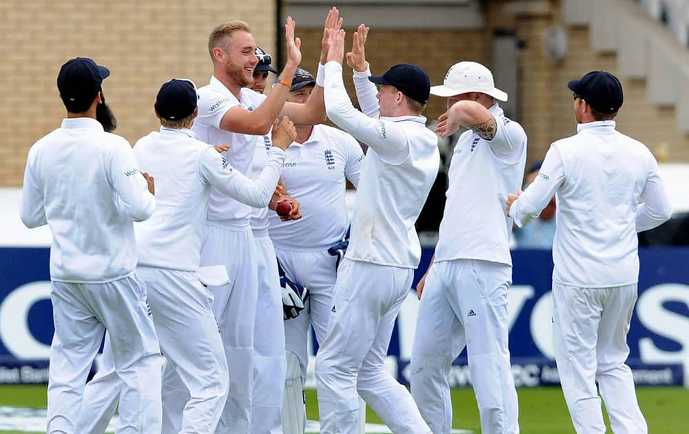 England's Stuart Broad, 3rd left, celebrates after getting India's Virat Kohli LBW for 8 runs, on day five of the first Test between England and India at Trent Bridge cricket ground, Nottingham, England.