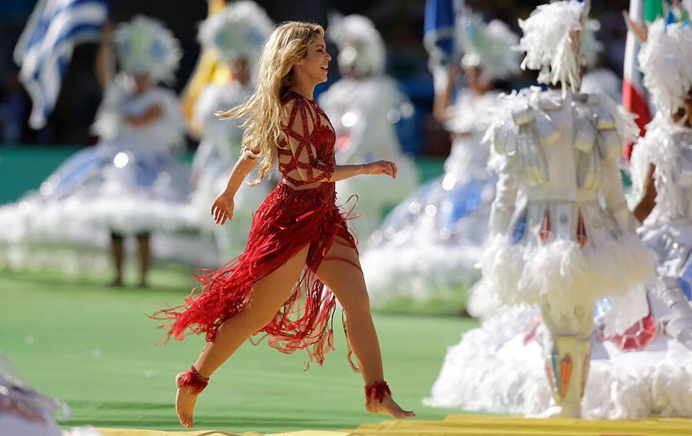 Shakira leaves the pitch after performing before the start of the World Cup final soccer match between Germany and Argentina at the Maracana Stadium in Rio de Janeiro, Brazil.